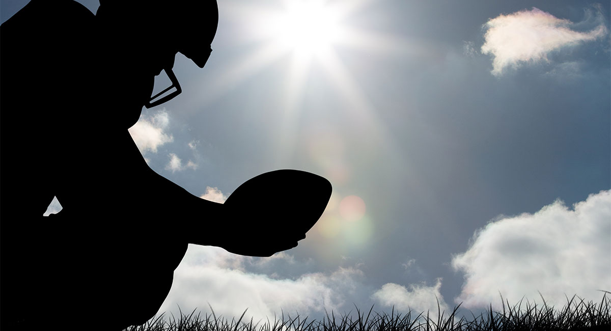 American football on a field in Novato, California, representing Payam Ravanfar’s cross-training for goalkeeping